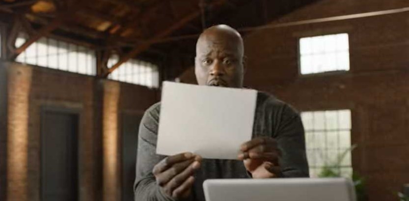 Shaq looks in awe at white paper