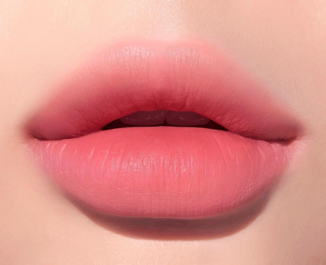 a closeup of light pink gradient shade on lips 