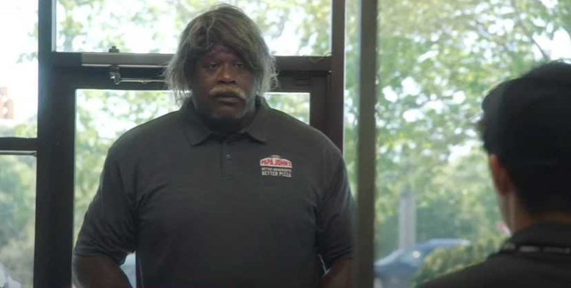 Shaq with a wig and mustache