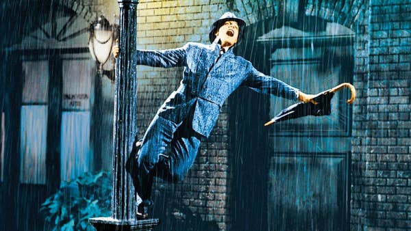 Gene Kelly dances in the rain in the film