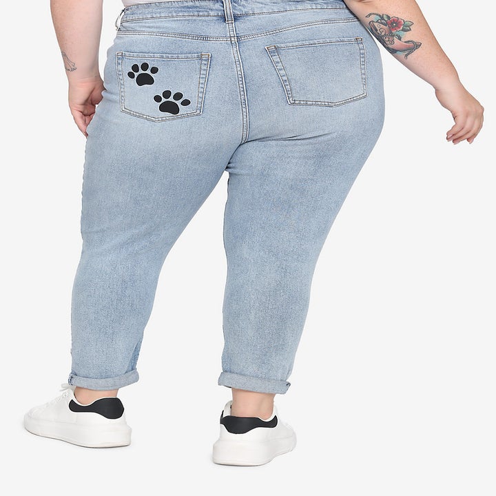 model from behind showing the paw prints on one of the back pockets