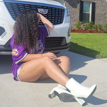 a reviewer wearing a jersey, shorts, and white booties 
