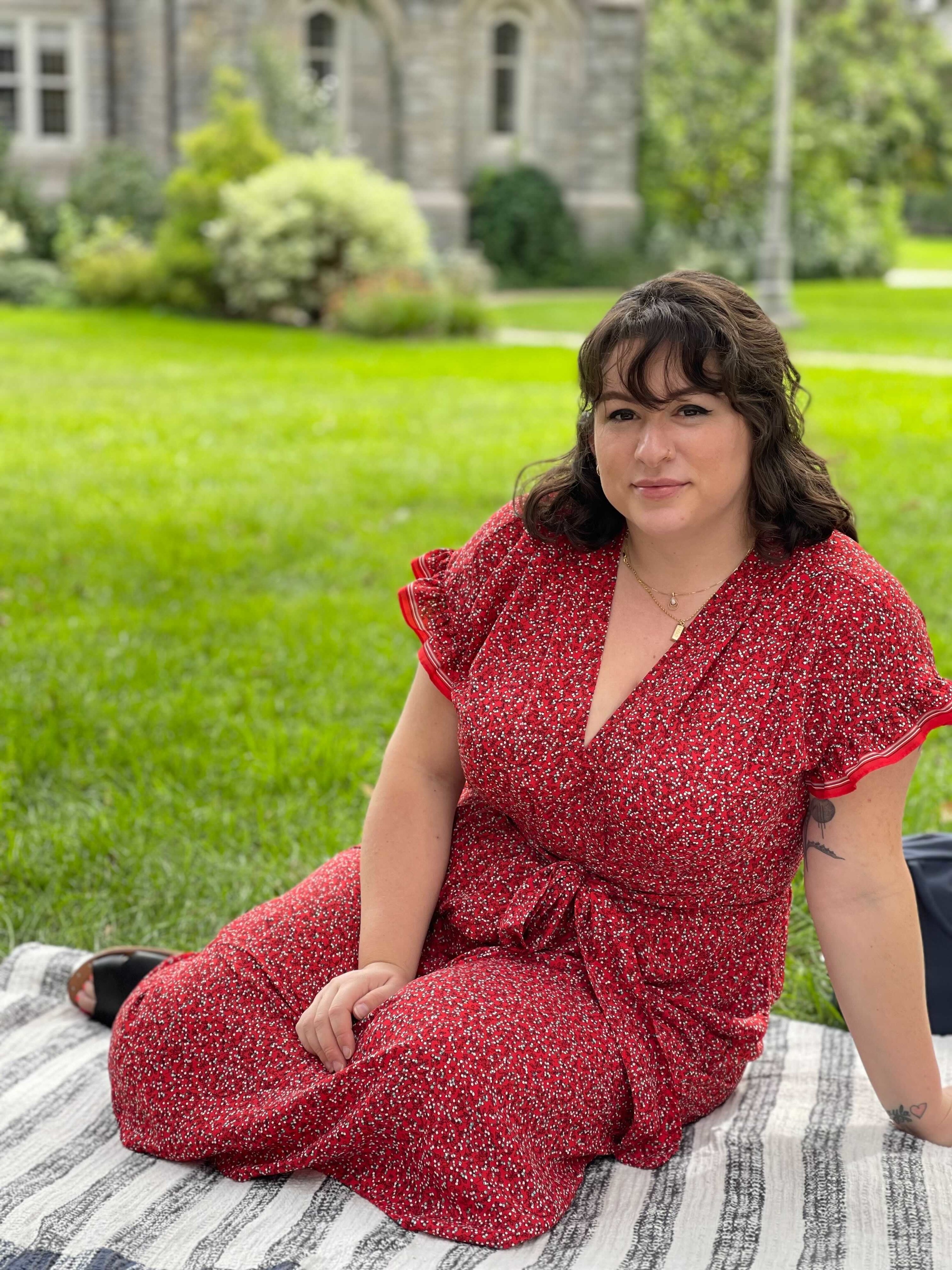 Image of Cheyenne sitting on the grass