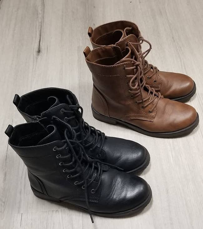a reviewer photo of a pair of black lace-up boots and a pair of brown lace-up boots 