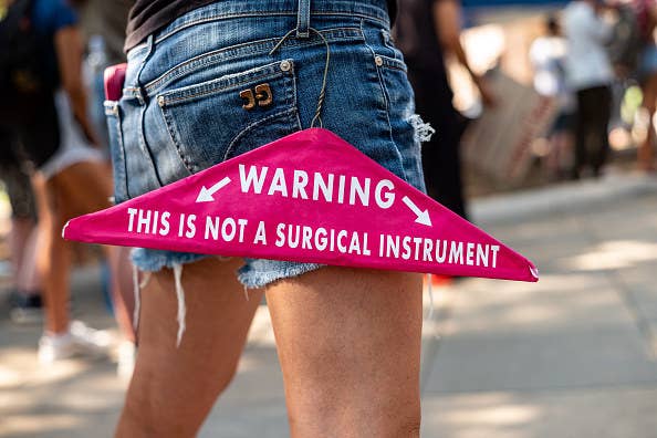 A clothing hanger that says &quot;warning: this is not a surgical instrument&quot;