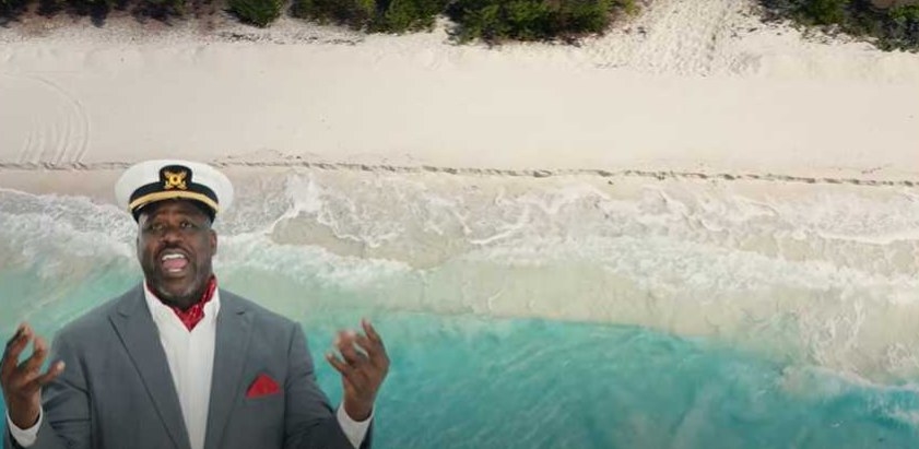 Shaq sings in front of green screen of beach waves