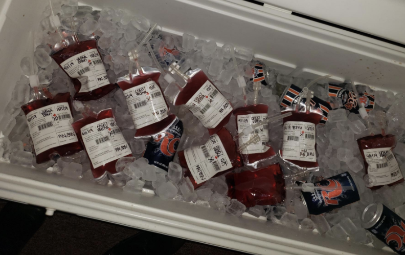 the blood bag drink holders in a cooler with other drinks