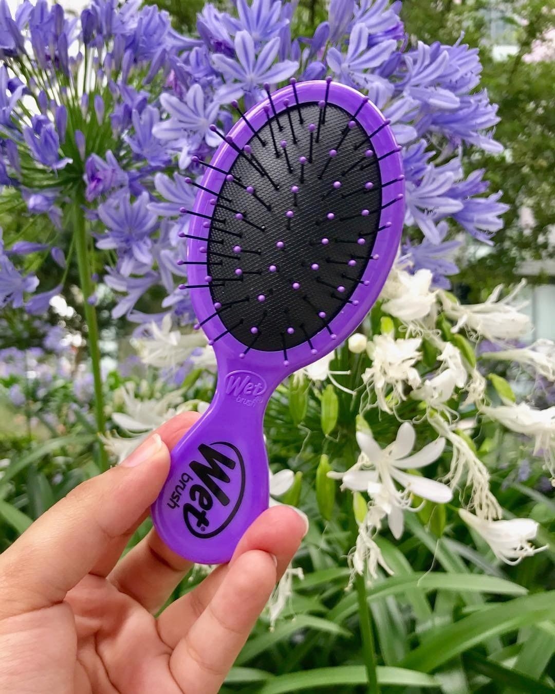 A person holding the wetbrush
