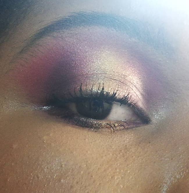 Reviewer with blend of purple and silver shadow on their eyelid
