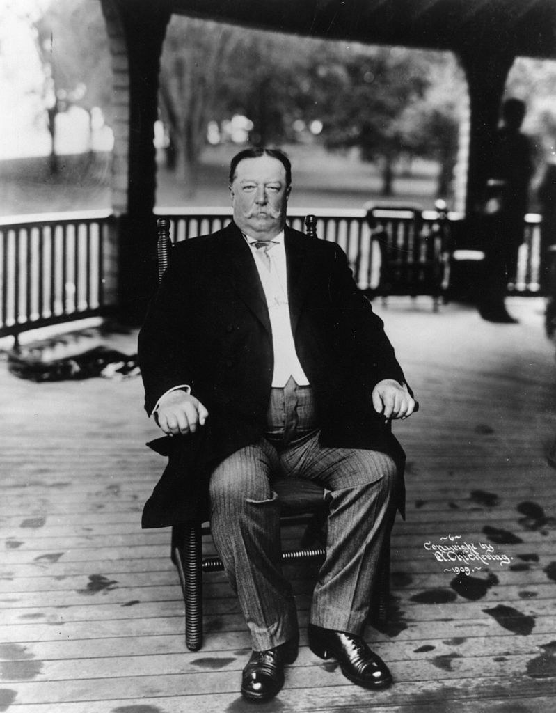 Taft sitting on his porch