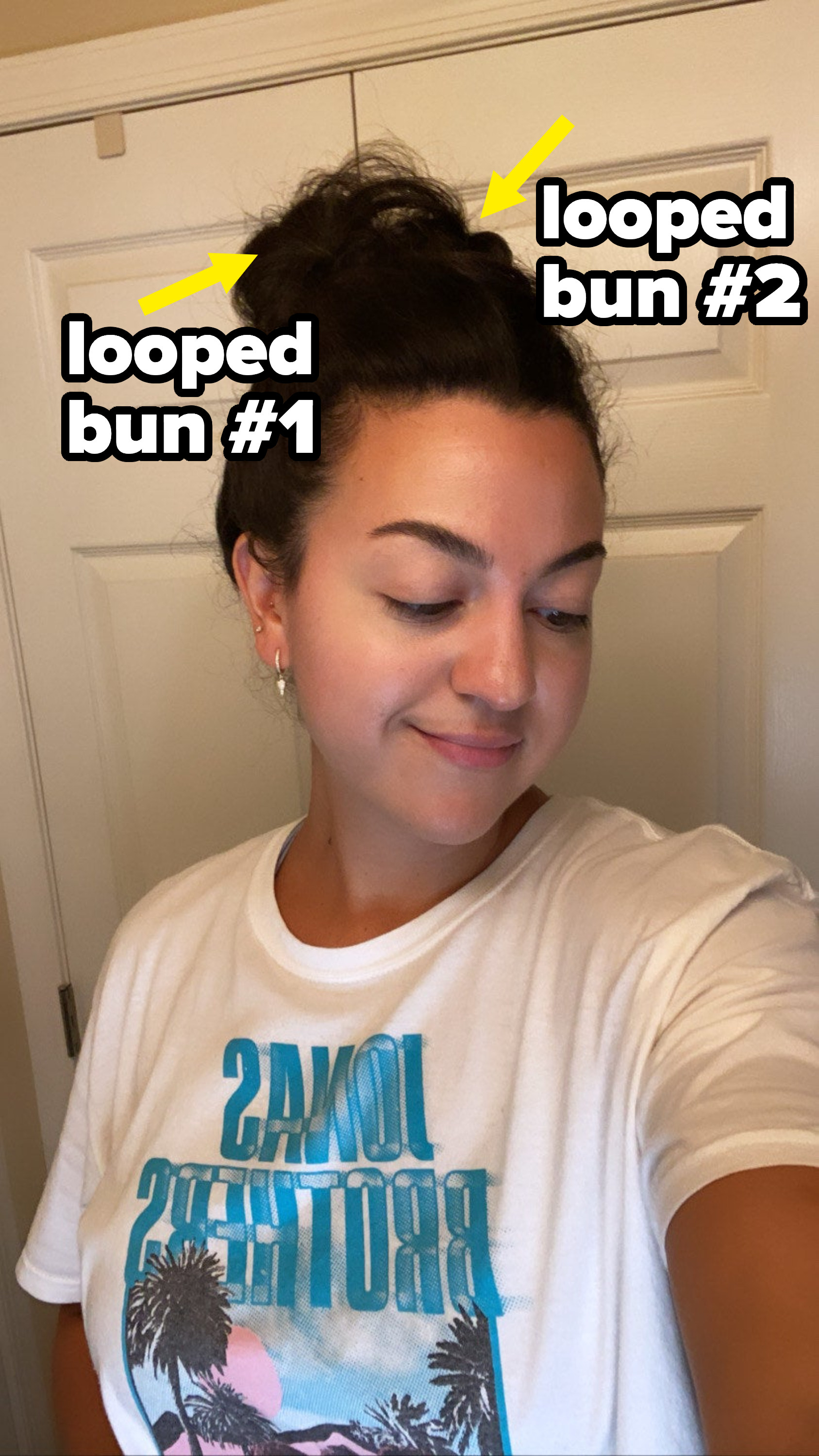 The author trying the bun hair hack