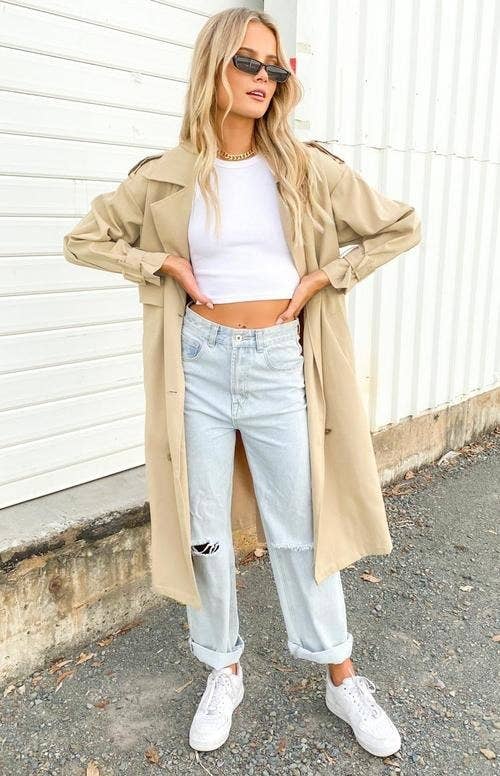 model wearing the tan trench coat