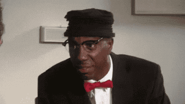 A gif of a man looking shocked and impressed