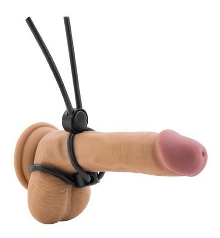 Black double loop adjustable cock ring demonstrated on realistic dildo