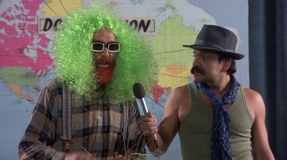 Cheech and Chong standing in front of a map. 