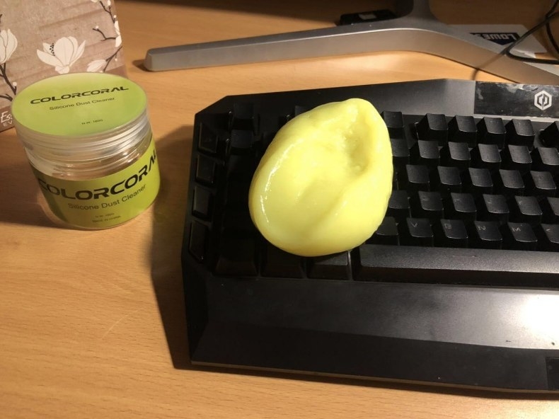 Yellow gel cleaner over black keyboard