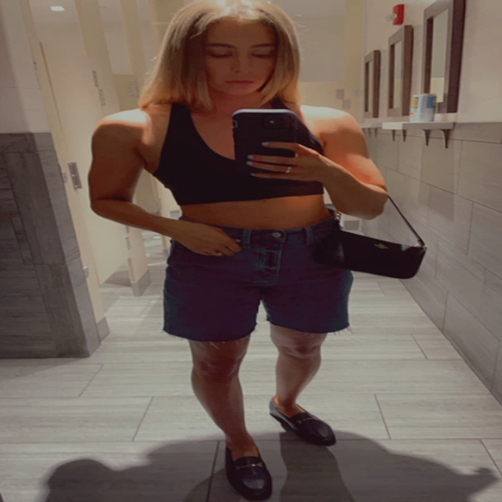 reviewer wearing black loafers in mirror selfie