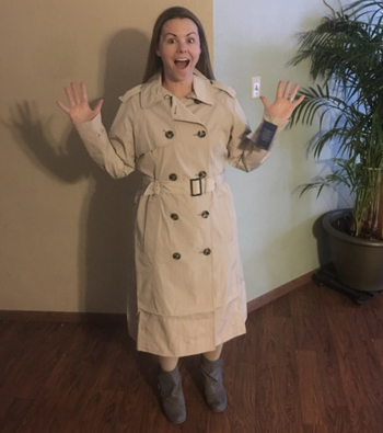 reviewer wearing trench coat 