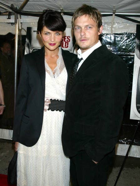 Norman Reedus and Helena Christensen smile for the camera