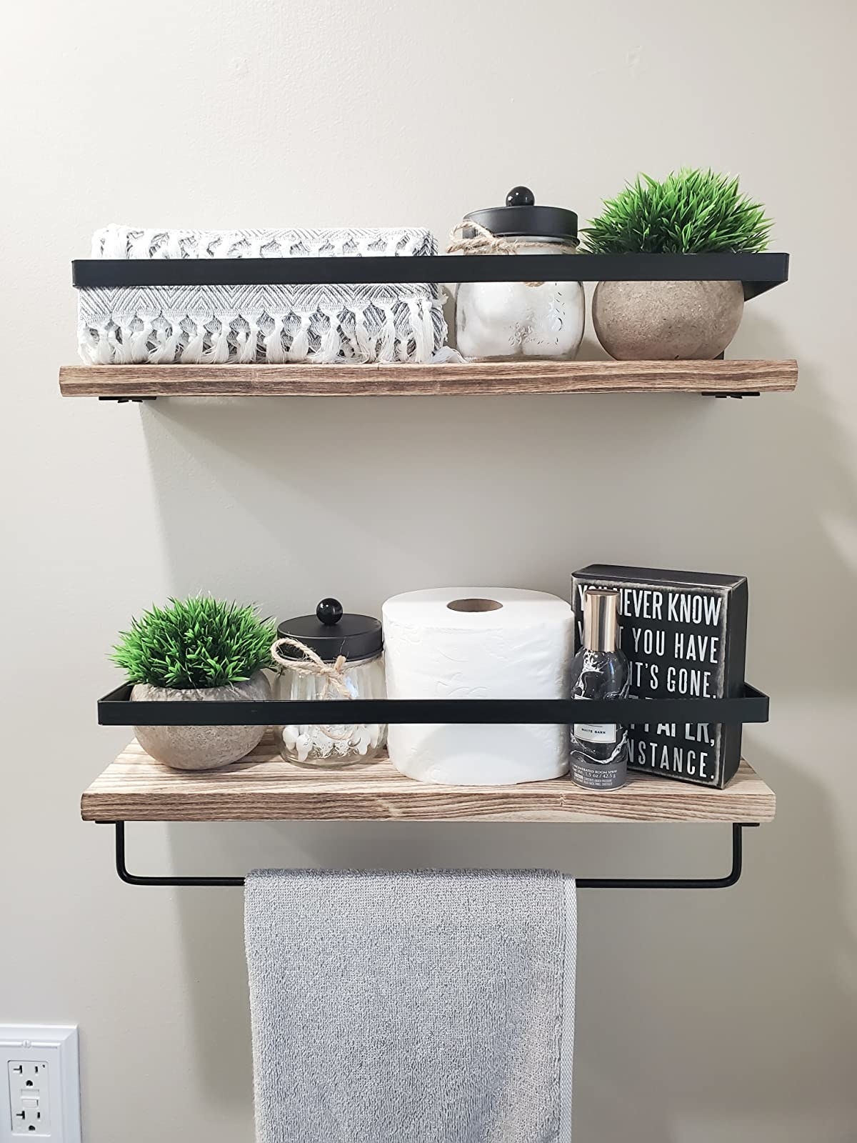 Reviewer photo of the two plants on floating shelves in a bathroom
