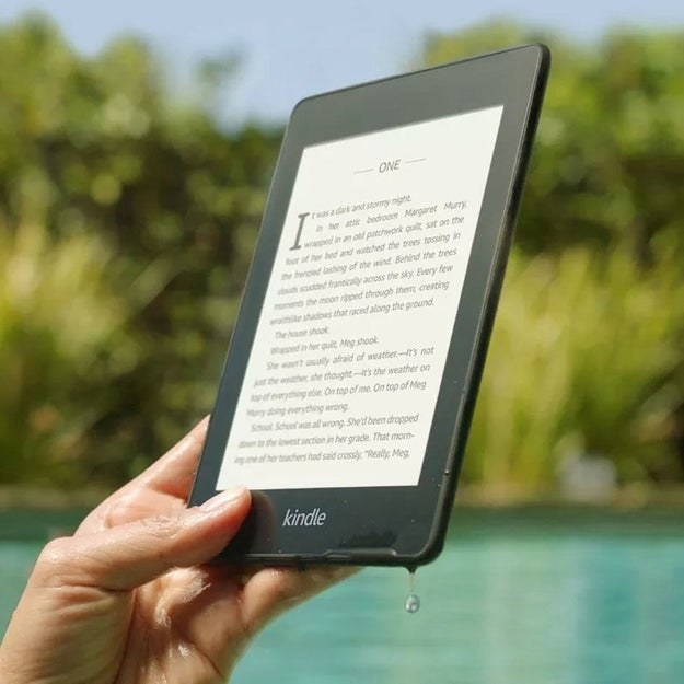 a hand holding the kindle