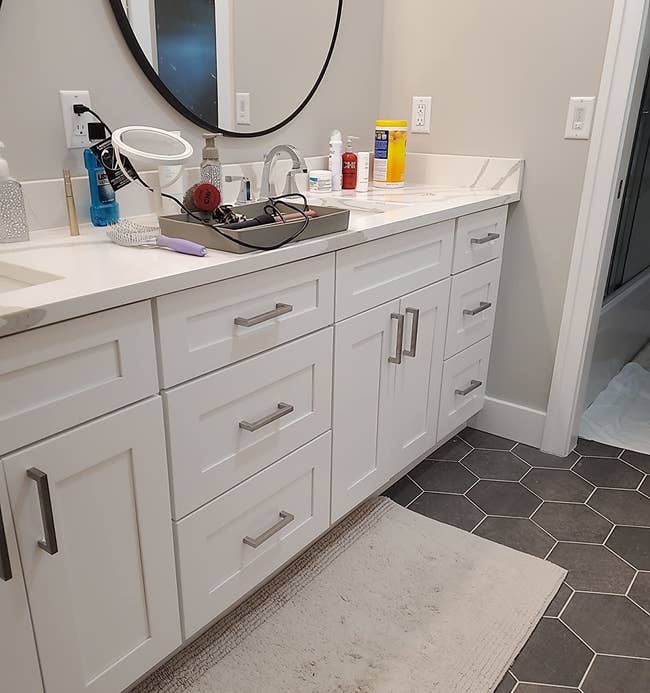 Reviewer photo of the handles installed on a bathroom vanity