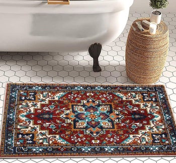 bath mat on tile floor that looks like a miniature version of a classic oriental rug