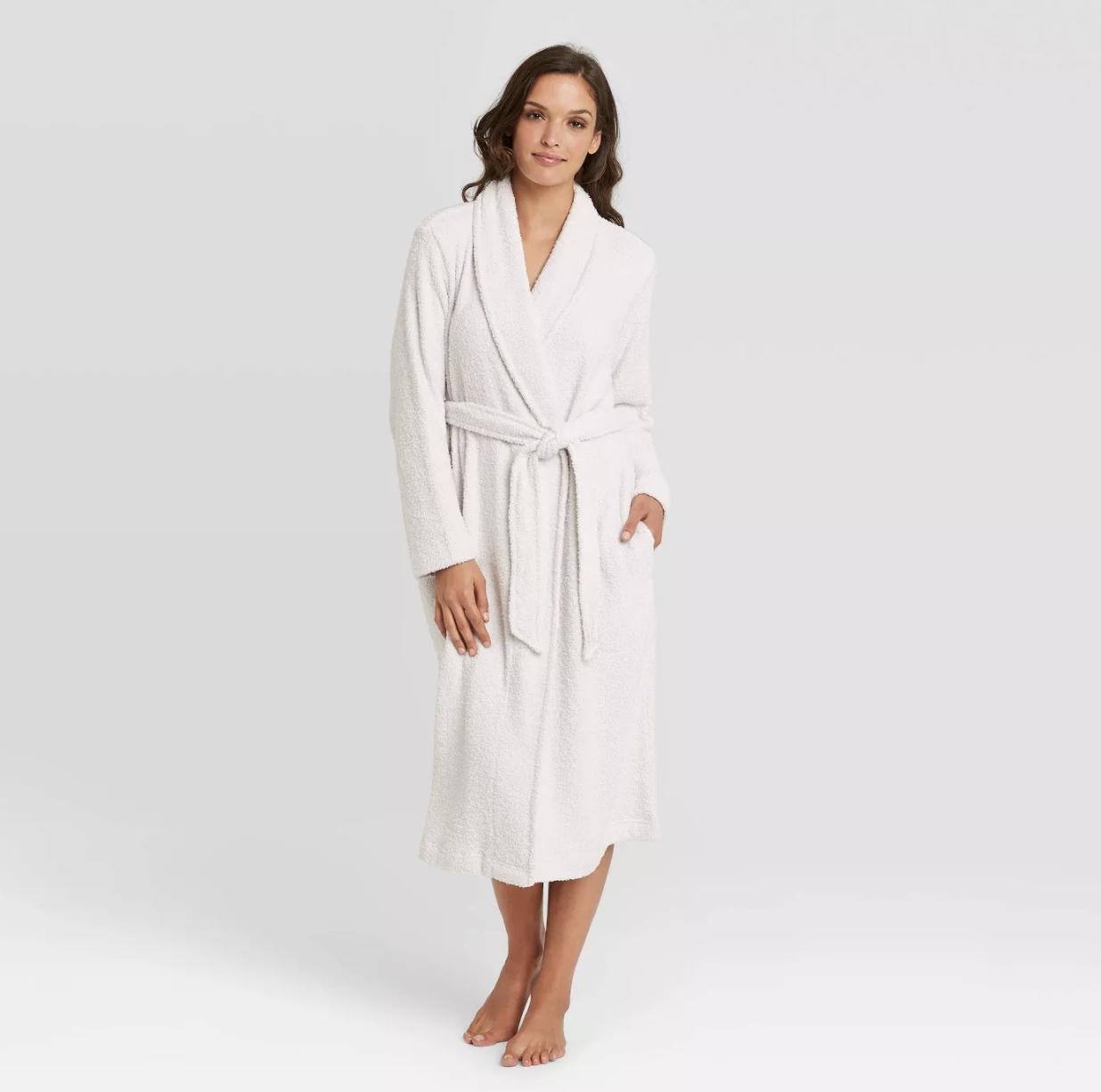 Model is wearing a white plush robe