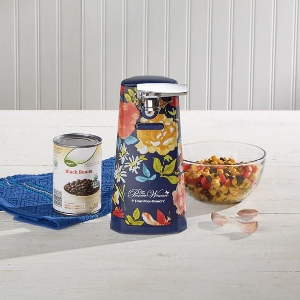 The can opener with a bold floral pattern on a kitchen counter