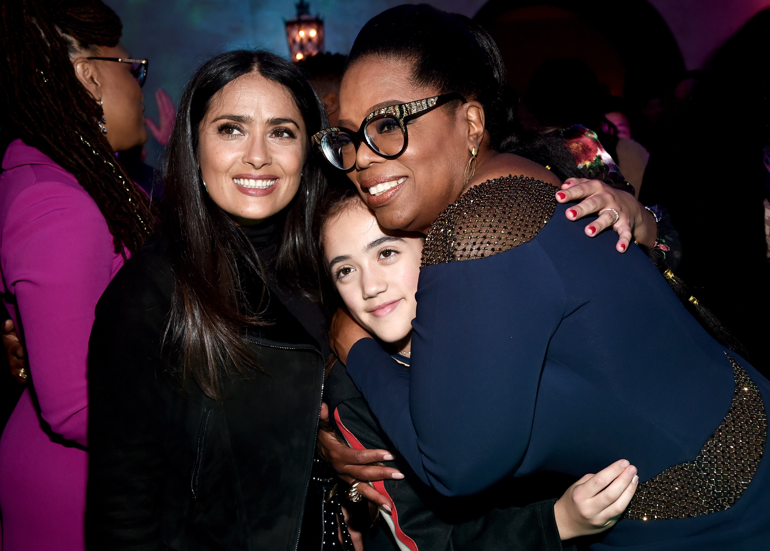 Salma and Oprah hug Valentina tight at an event