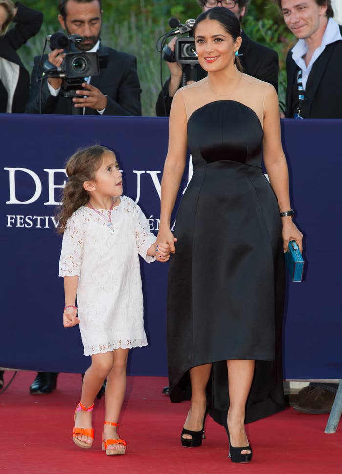 Salma holds hands with Valentina as a little girl