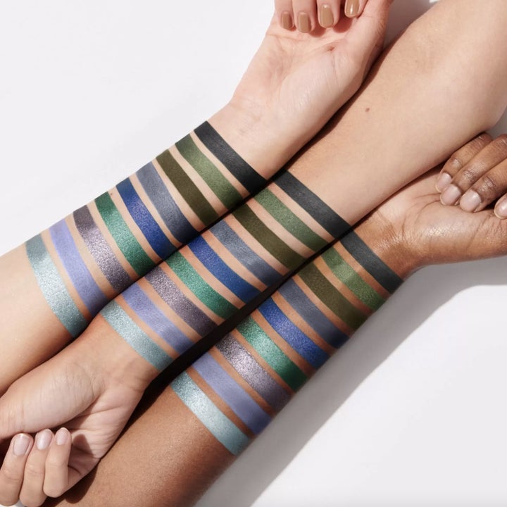 Three arms with different skin tones showing swatches of each eyeshadow shade