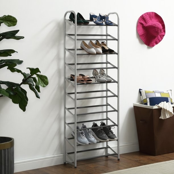 A tall shoe rack decorated with various shoes