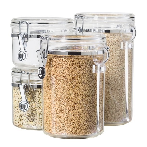 Four clear containers filled with grains