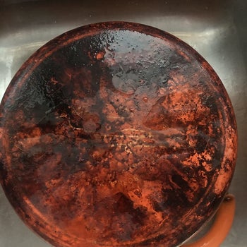 very burnt bottom of a reviewer's orange pot