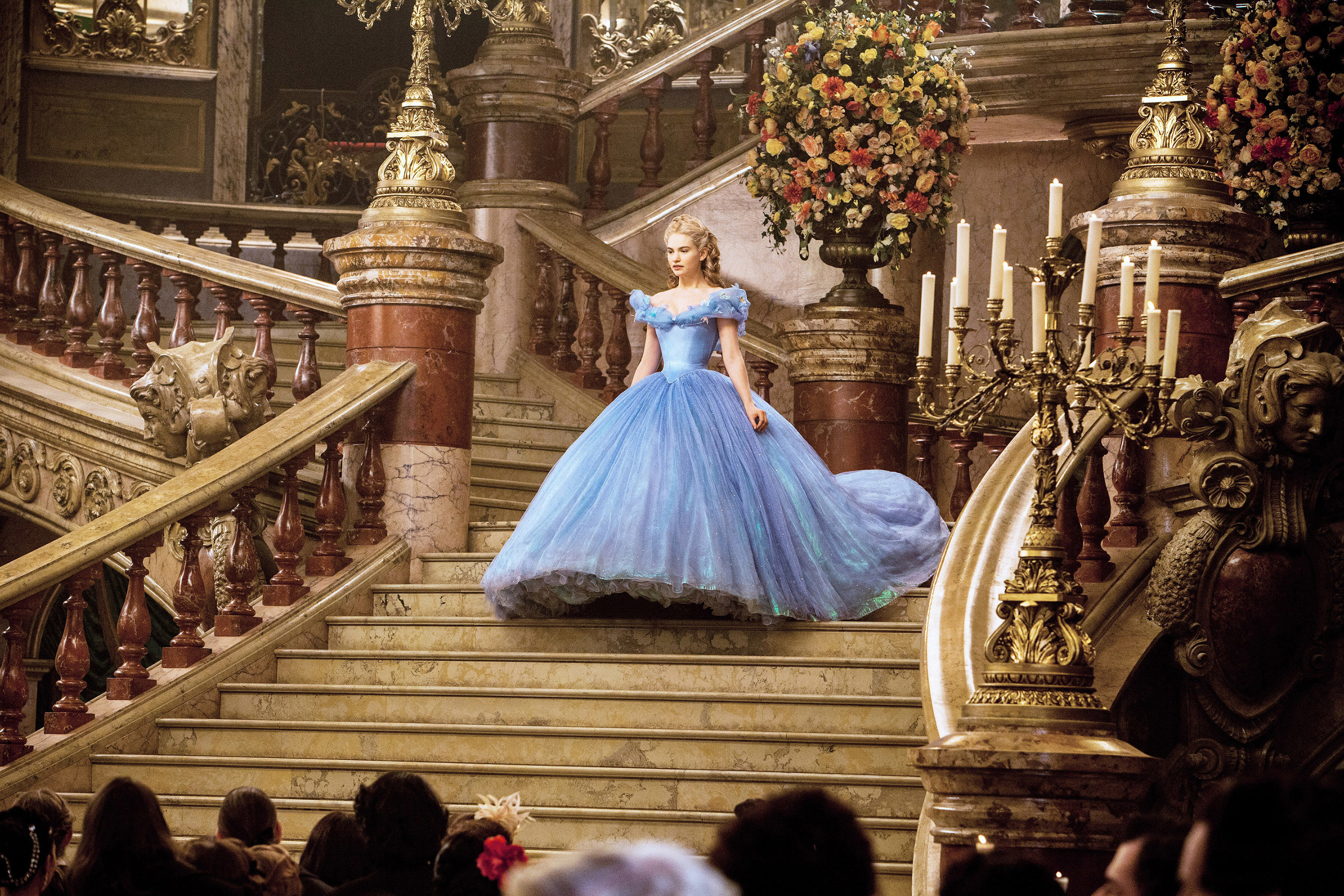 Lily James as Cinderella in a blue gown