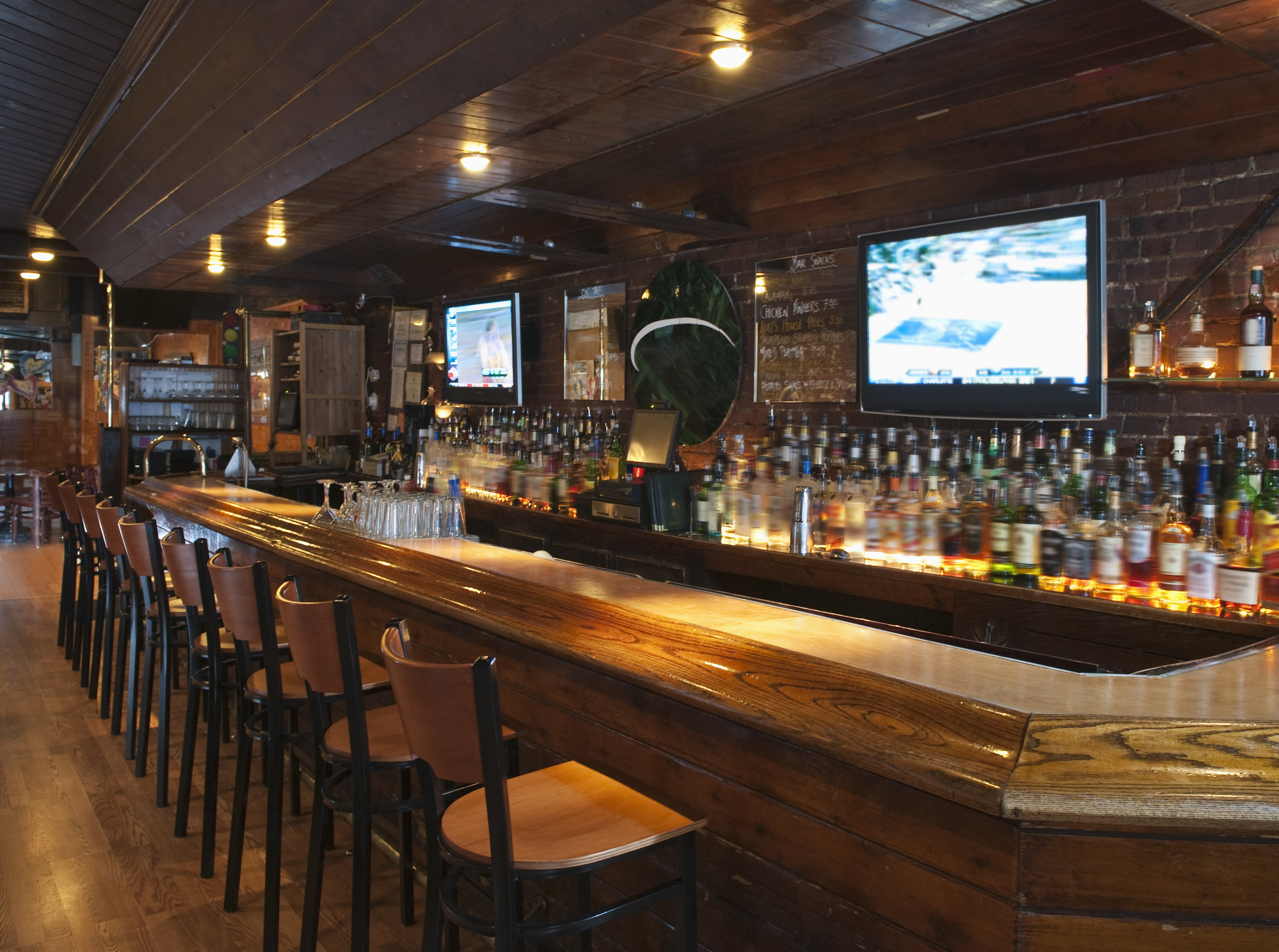 A bar with chairs