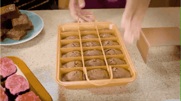 gif of person removing dividers and revealing pre-cut brownie slices