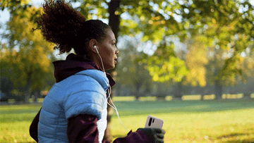 Woman jogging in park.