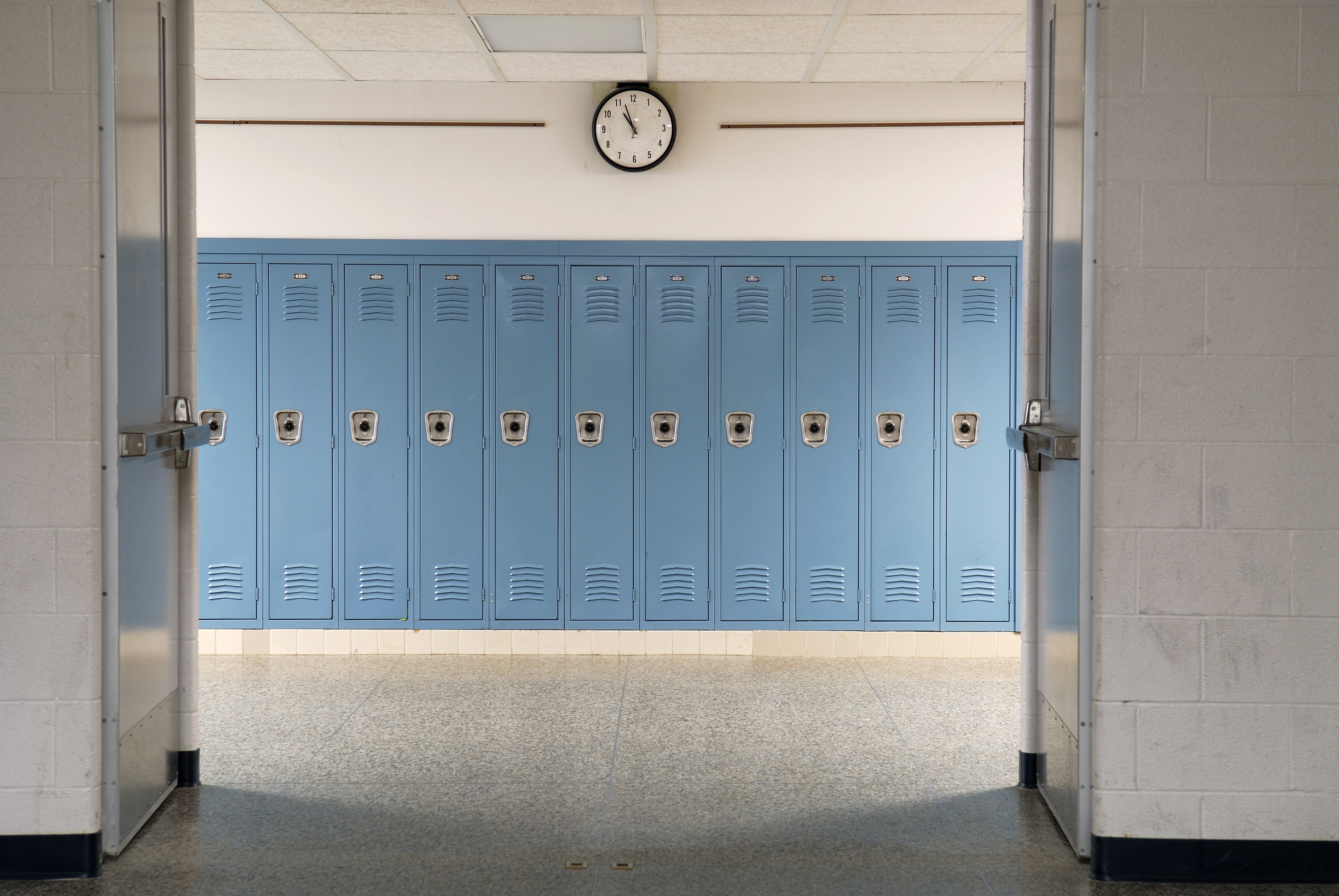 lockers in an empty high school hallway