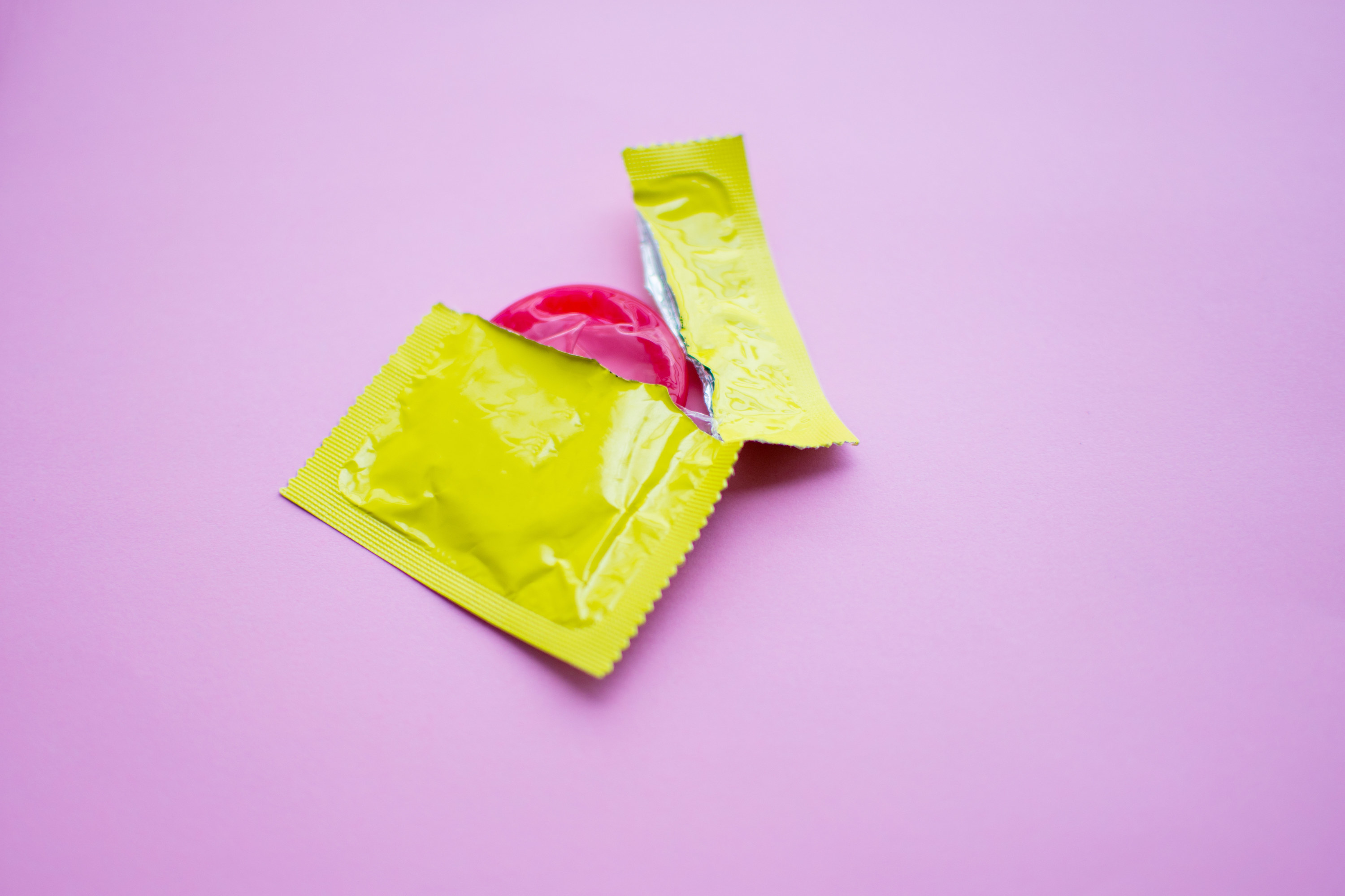 A condom in a half-ripped wrapper