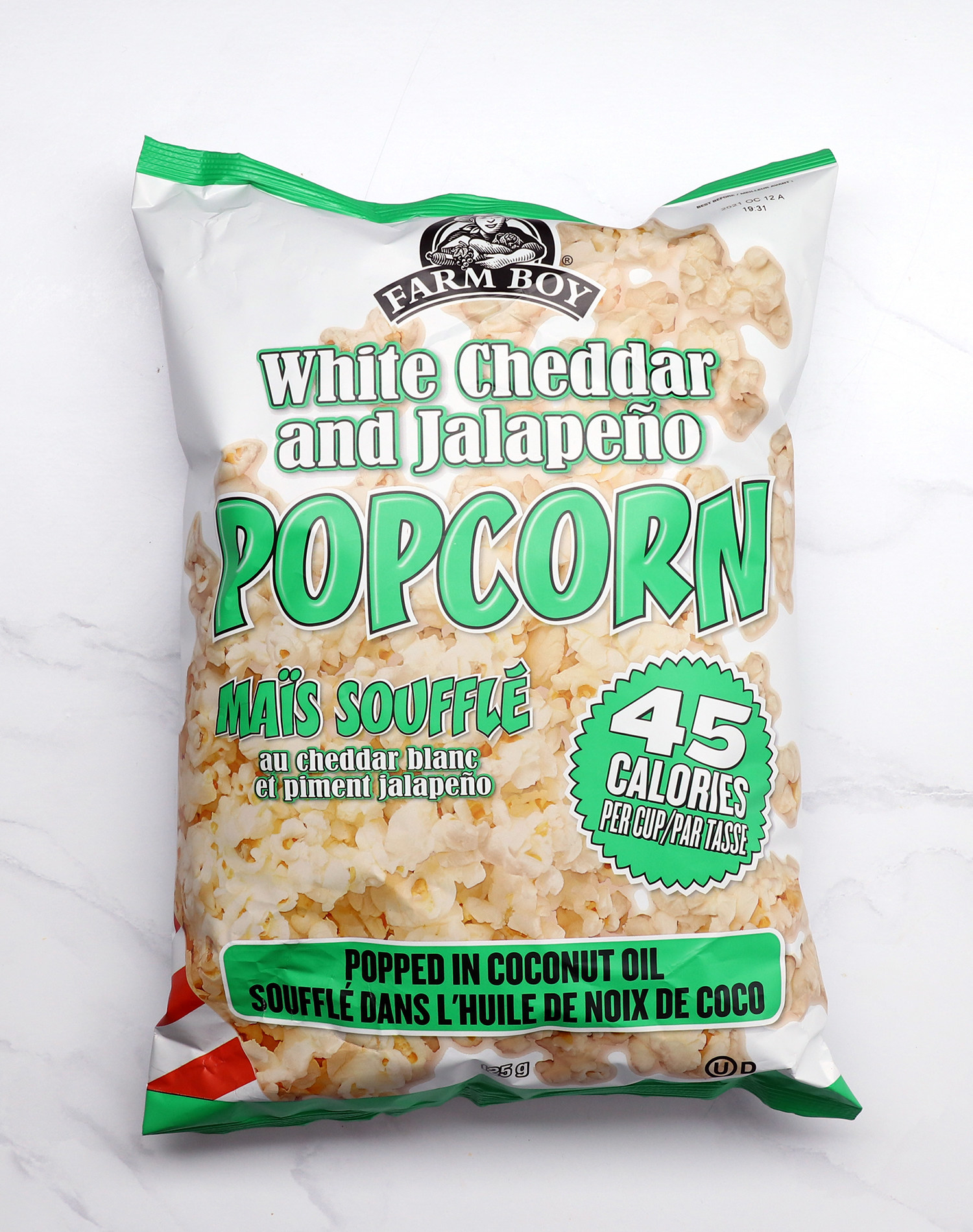 An overhead product shot of White Cheddar and Jalapeno popcorn