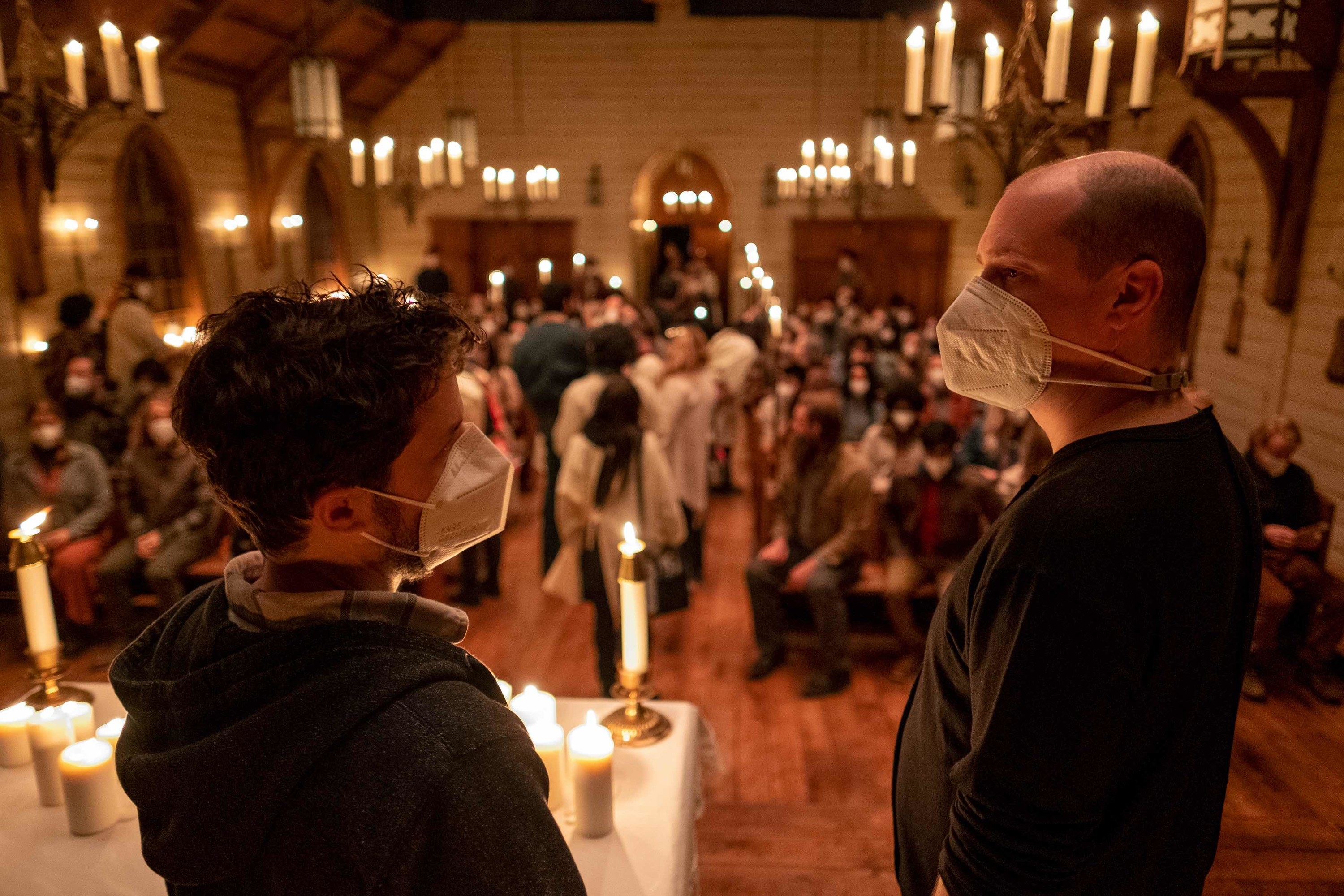 Two people on set wearing face masks