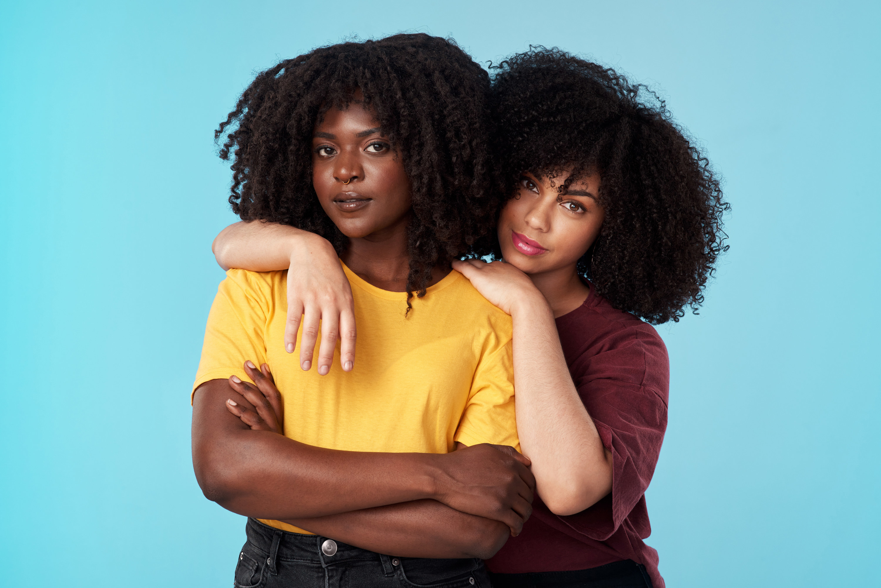 Two Black women embracing