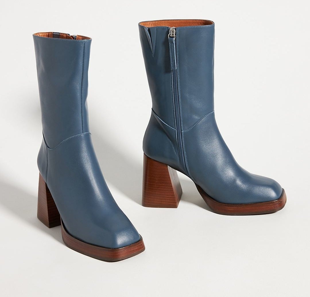 blue boots with a thick dark wooden base