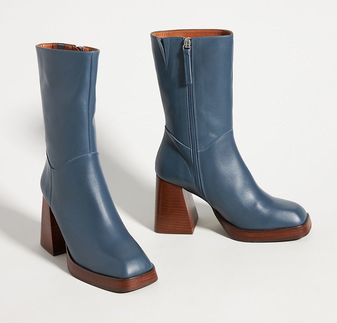 blue boots with a thick dark wooden base
