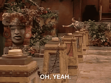 The host of Legends Of The Hidden Temple points at the talking head Olmec and says &quot;oh, yeah.&quot;