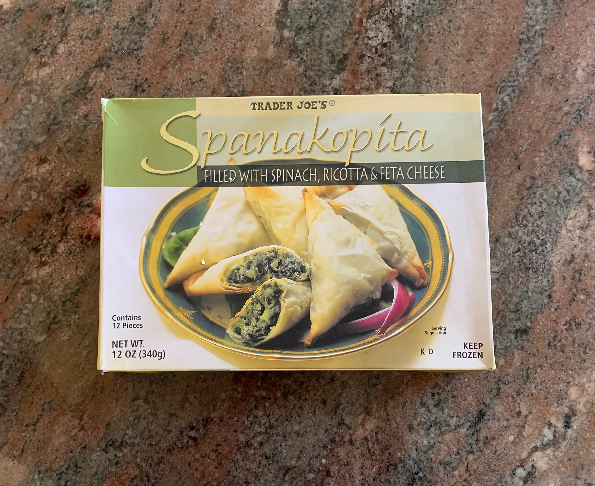 A box of spanakopita on the counter