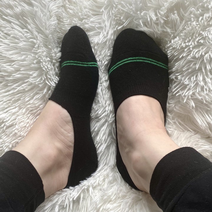 BuzzFeed writer wearing black Pact socks