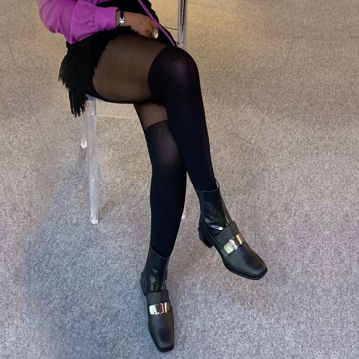 model wearing the boots with black tights